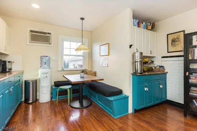 a room with a window wooden floor and gym equipment