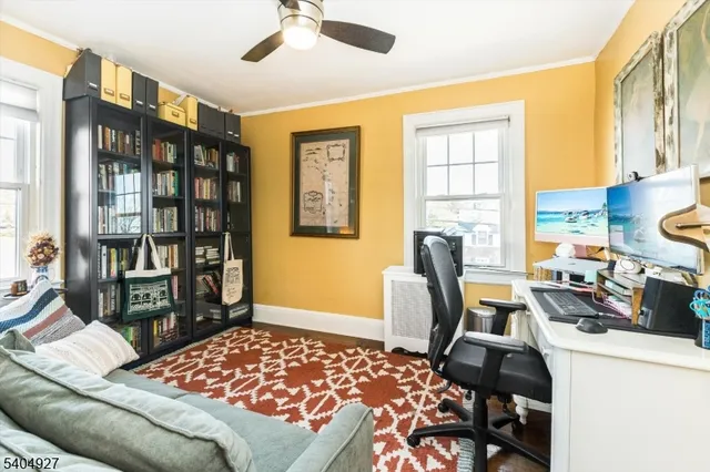 a bedroom with a workspace