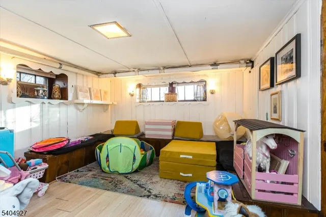 a kids room with toys and dresser