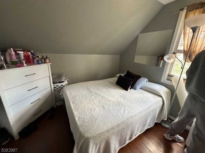 3 Webster Road Somerset, NJ 08873 - Photo 4 of 4 a bedroom with a bed and wooden floor