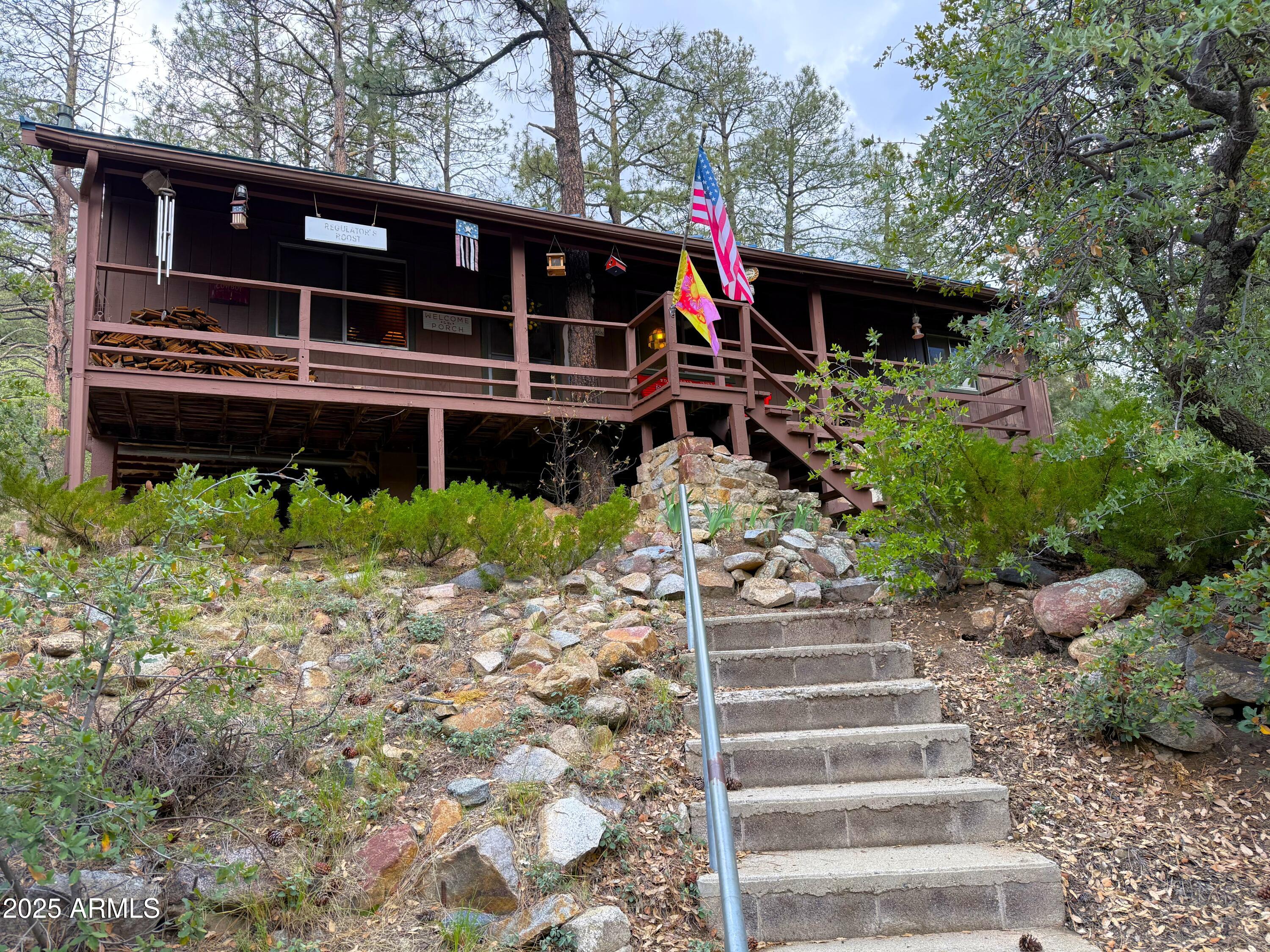 23298 South Towers Mountain Road Crown King, AZ 86343 - Photo 15 of 27 a front view of a house with a yard