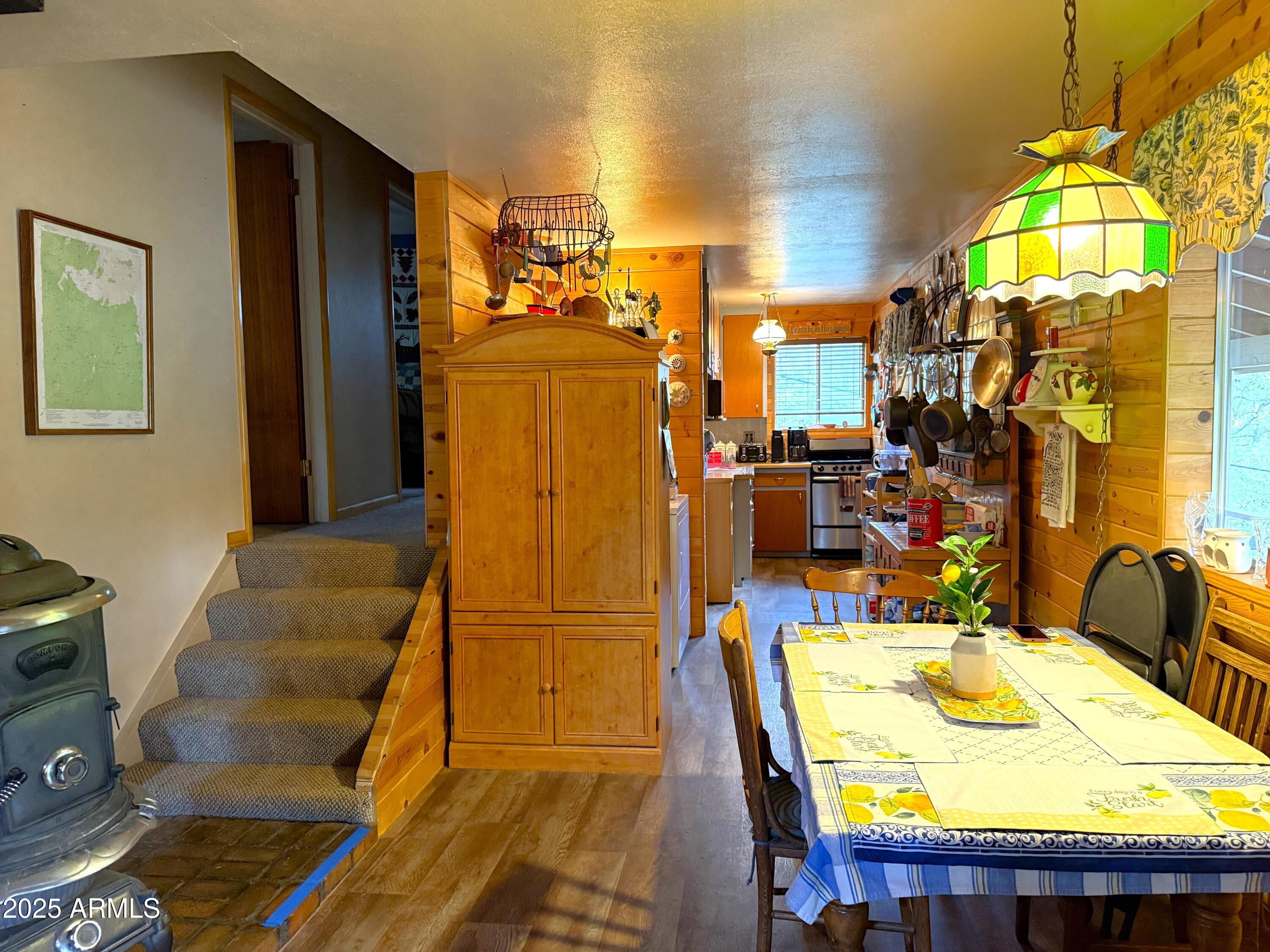 23298 South Towers Mountain Road Crown King, AZ 86343 - Photo 17 of 27 a dining room with furniture and a chandelier