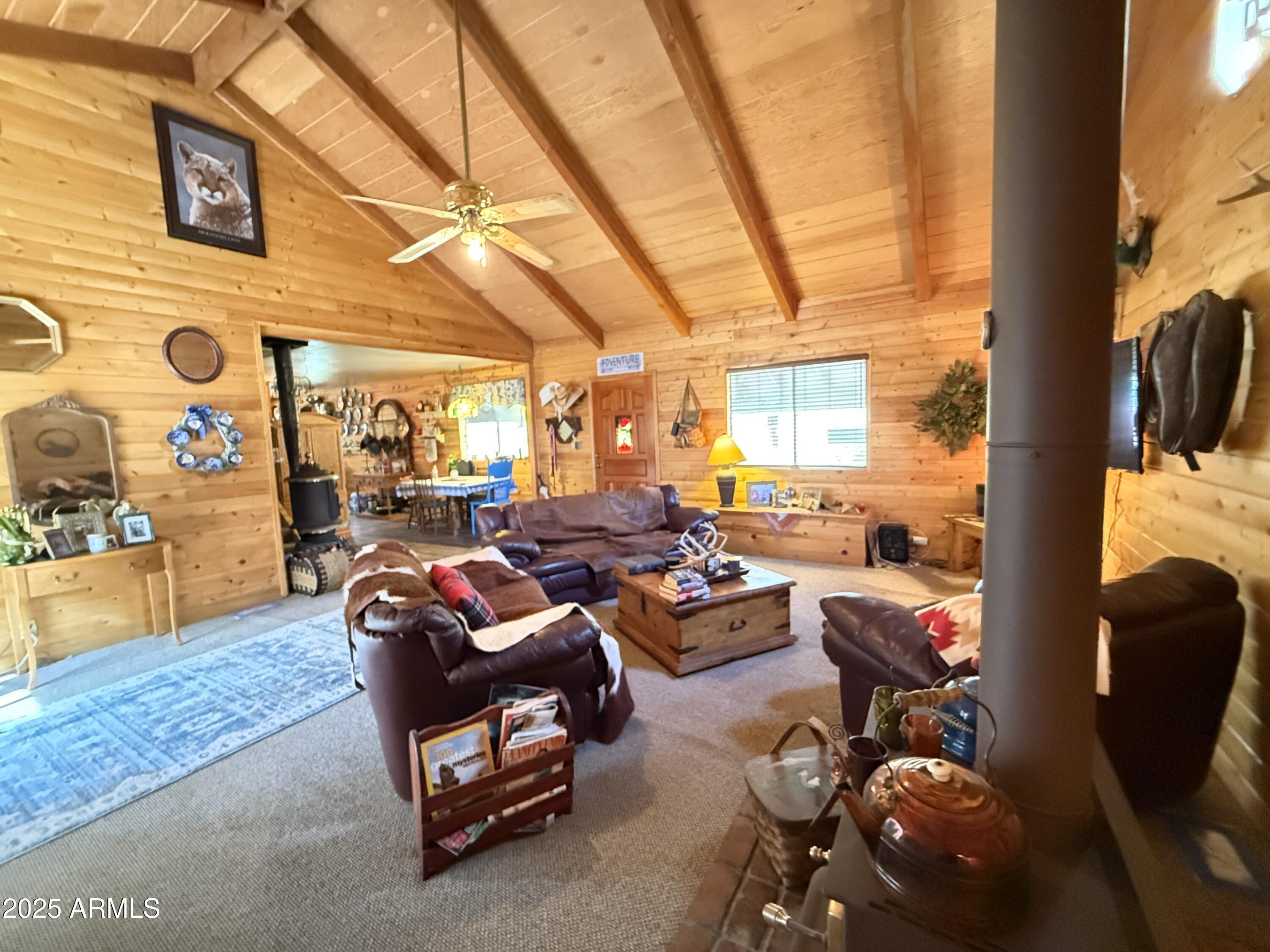 23298 South Towers Mountain Road Crown King, AZ 86343 - Photo 2 of 27 a living room with furniture and a flat screen tv