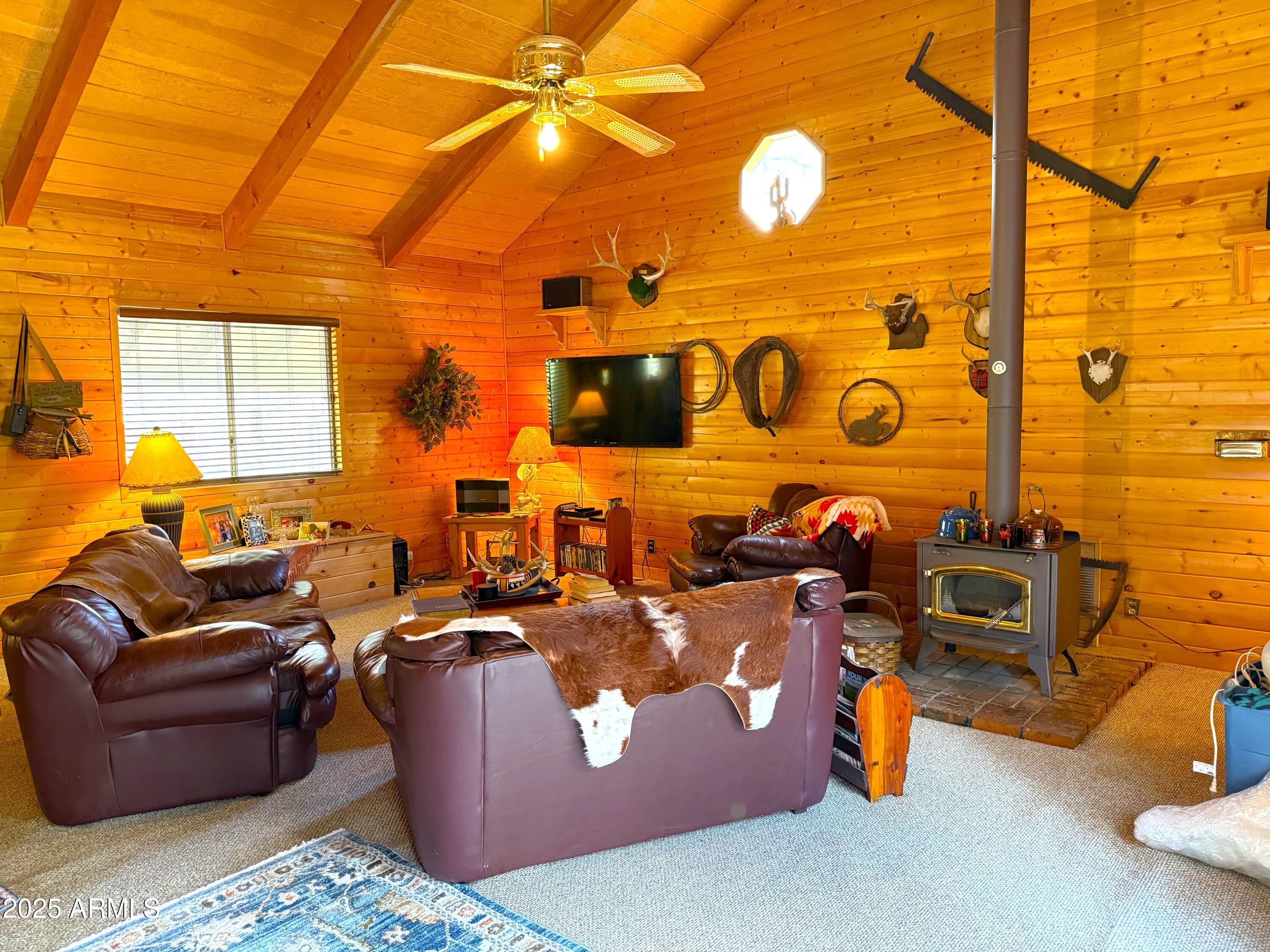 23298 South Towers Mountain Road Crown King, AZ 86343 - Photo 22 of 27 a living room with furniture and a flat screen tv