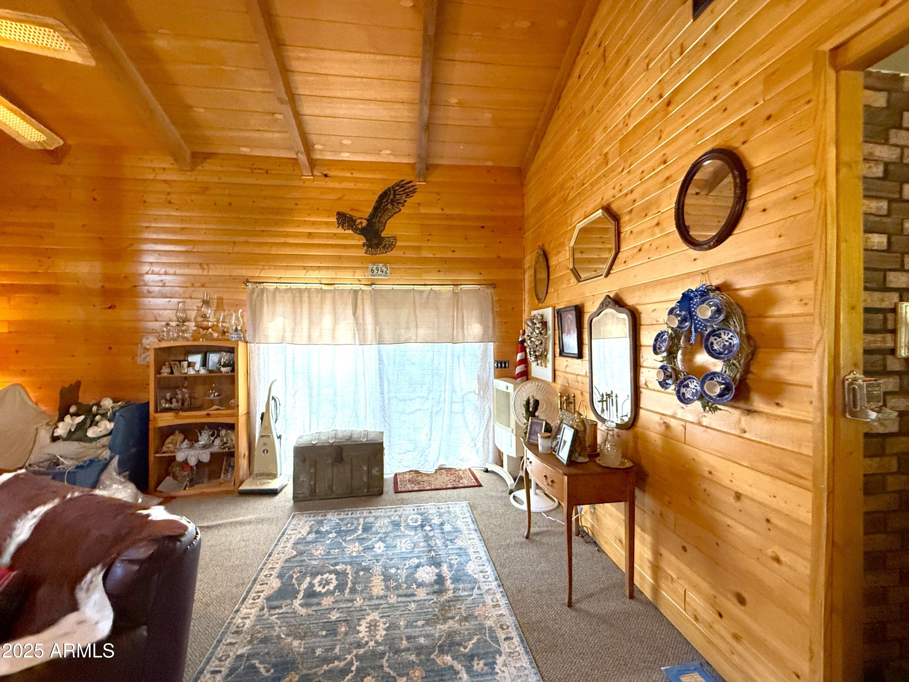 23298 South Towers Mountain Road Crown King, AZ 86343 - Photo 3 of 27 a living room with furniture and a fireplace