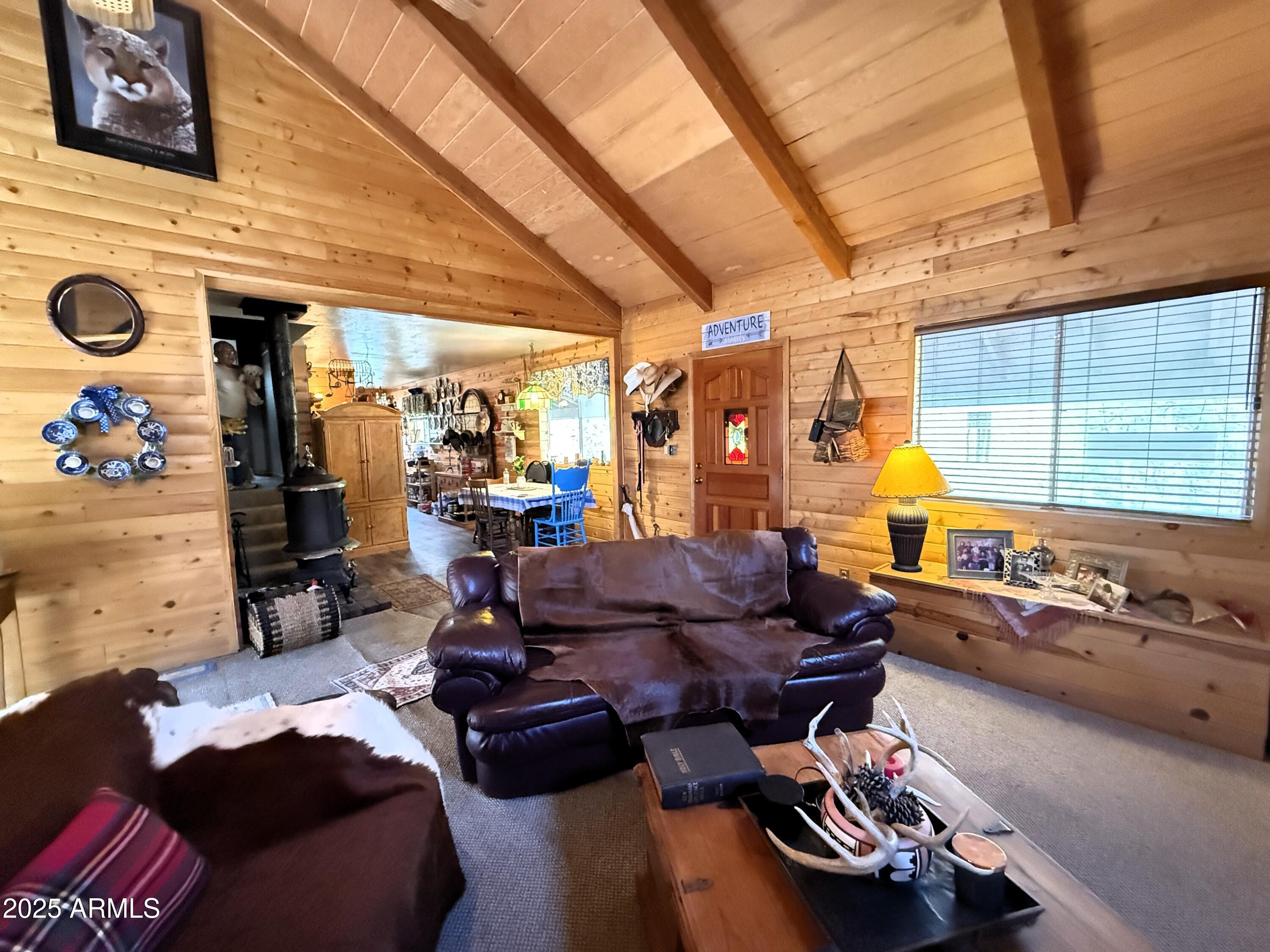 23298 South Towers Mountain Road Crown King, AZ 86343 - Photo 4 of 27 a living room with furniture a flat screen tv and a window