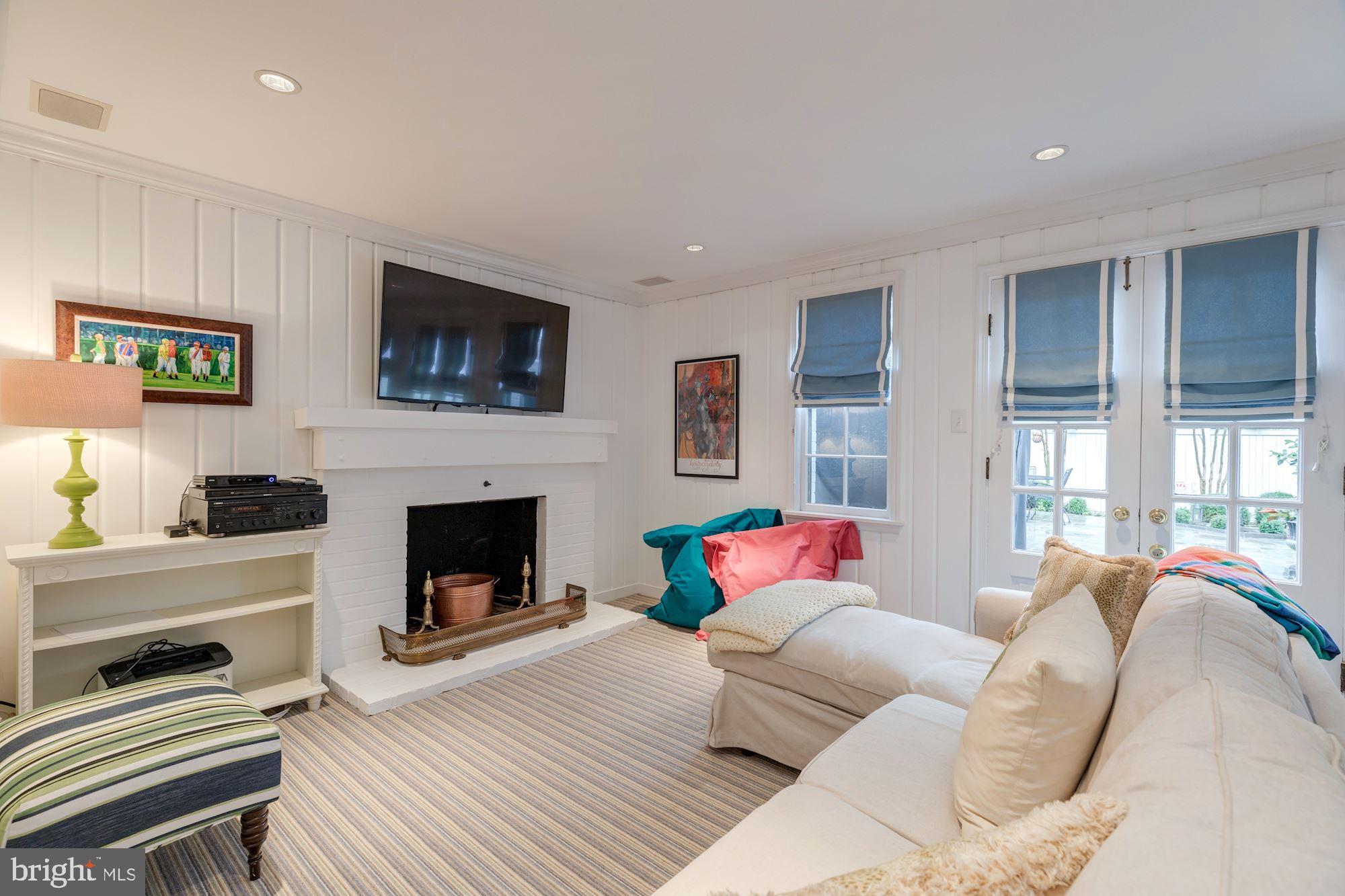 5301 Elliott Road Bethesda, MD 20816 - Photo 21 of 24 Lower Level - Recreation Room with Fireplace