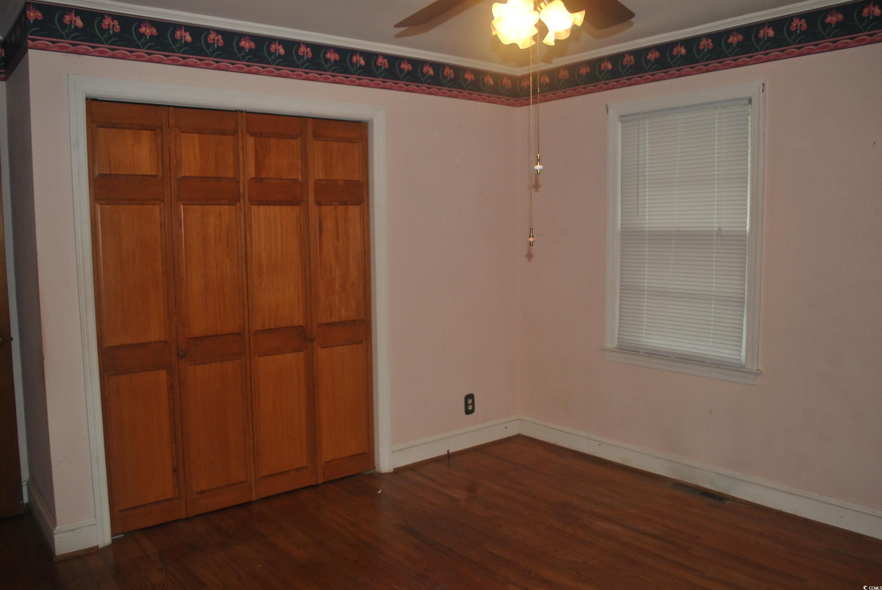 1726 Rice Street Georgetown, SC 29440 - Photo 12 of 28 Unfurnished bedroom featuring a closet, ceiling fa