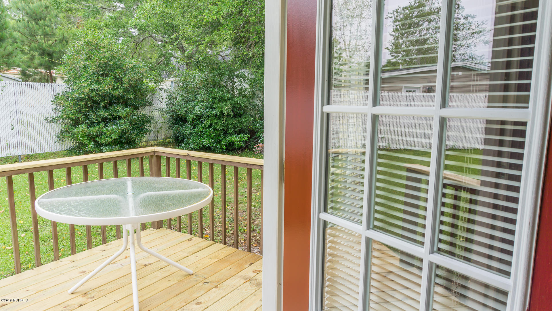 7295 Nursery Road Southwest Ocean Isle Beach, NC 28469 - Photo 23 of 31 Newly re-done private back porch for your morning coffee!