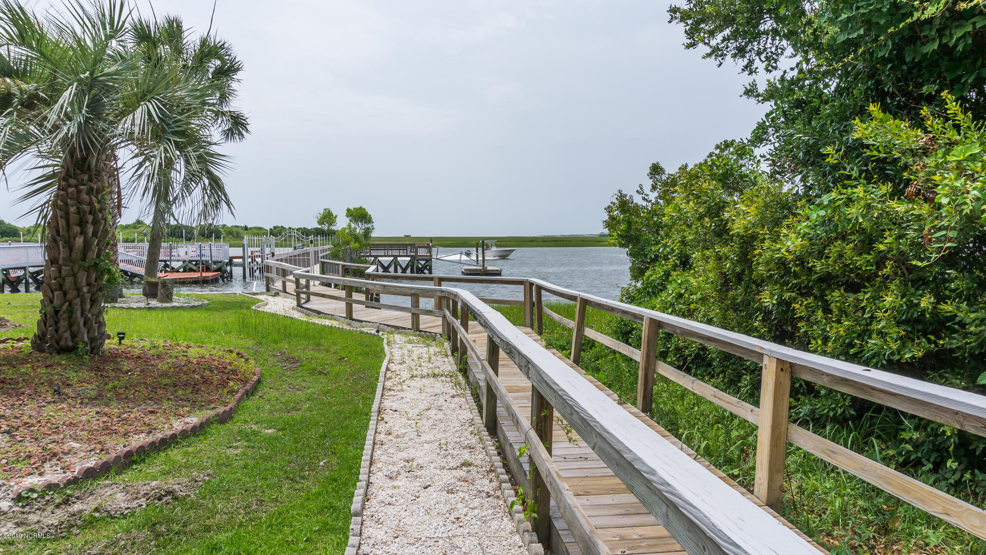 7295 Nursery Road Southwest Ocean Isle Beach, NC 28469 - Photo 24 of 31 Stroll down to the private Schnooner's Point fishing pier and Intracoastal Waterway boat dock (residents have option to join for $200 annually).