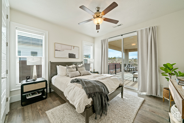 6026 Zen Trail Way St. George, UT 84790 - Photo 15 of 41 Bedroom with access to outside, wood finished floors, and ceiling fan