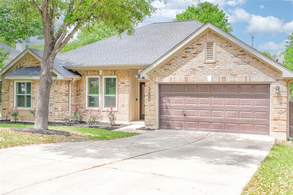 3600 Rip Ford Drive Austin, TX 78732 - Photo 3 of 32 a front view of a house with a yard and garage