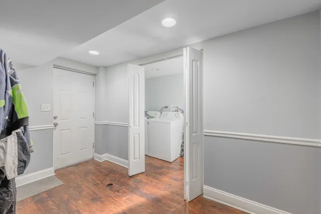 a view of entryway with wooden floor