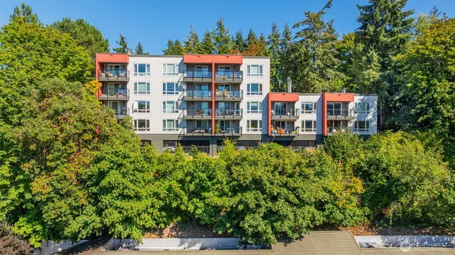 view of a building with a garden and pathway