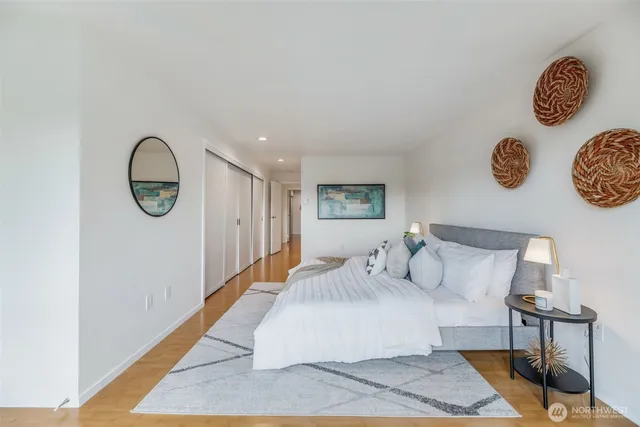 a bedroom with a bed and a table in it