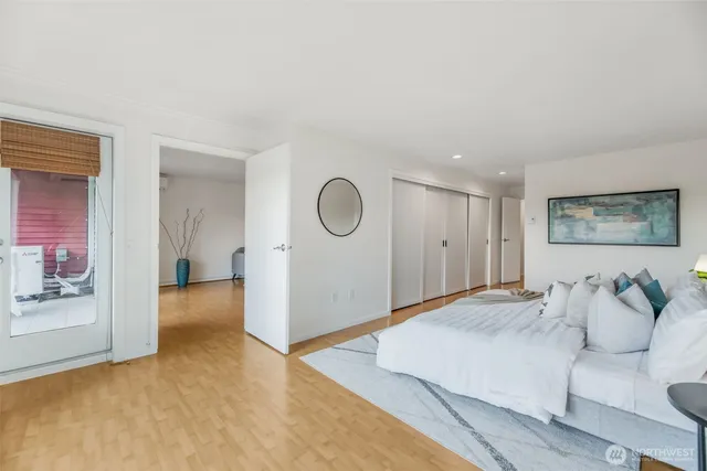 a spacious bedroom with a bed and a couch