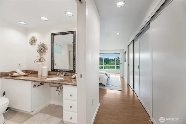 a view of a bathroom with a sink and mirror