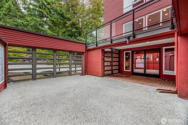 front view of a house with a yard and garage