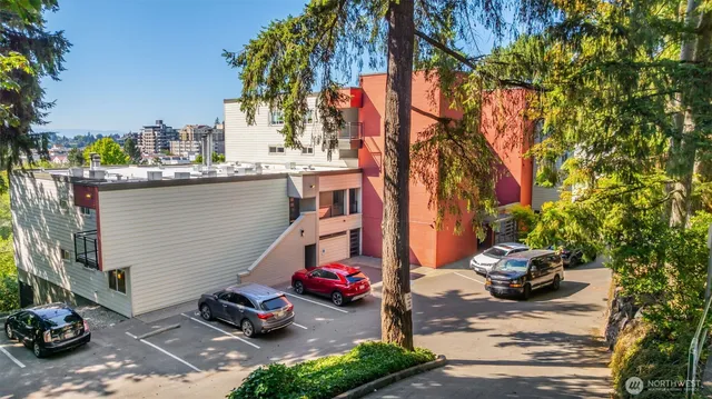 a backyard of a house with barbeque oven and outdoor seating