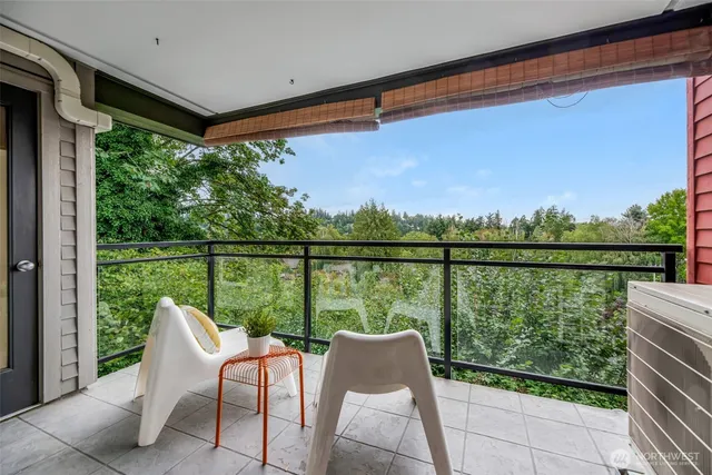 a balcony view with a seating space