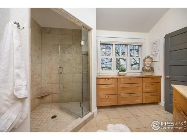 a bathroom with a shower and a sink