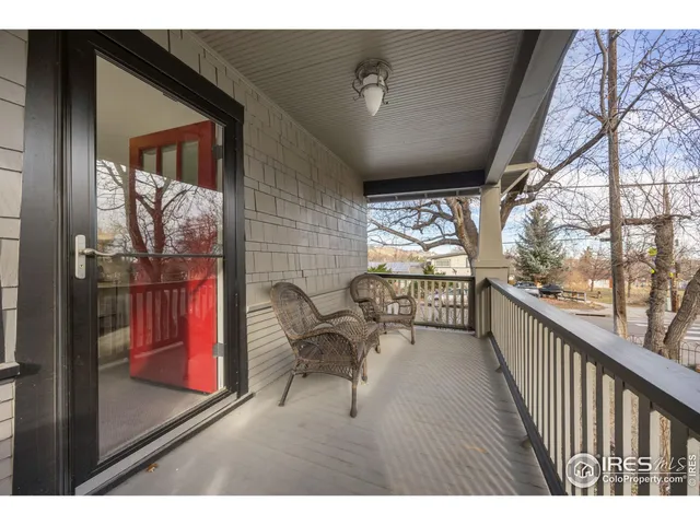 a view of a porch with furniture and next to a window
