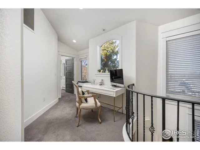 a workspace with furniture and window