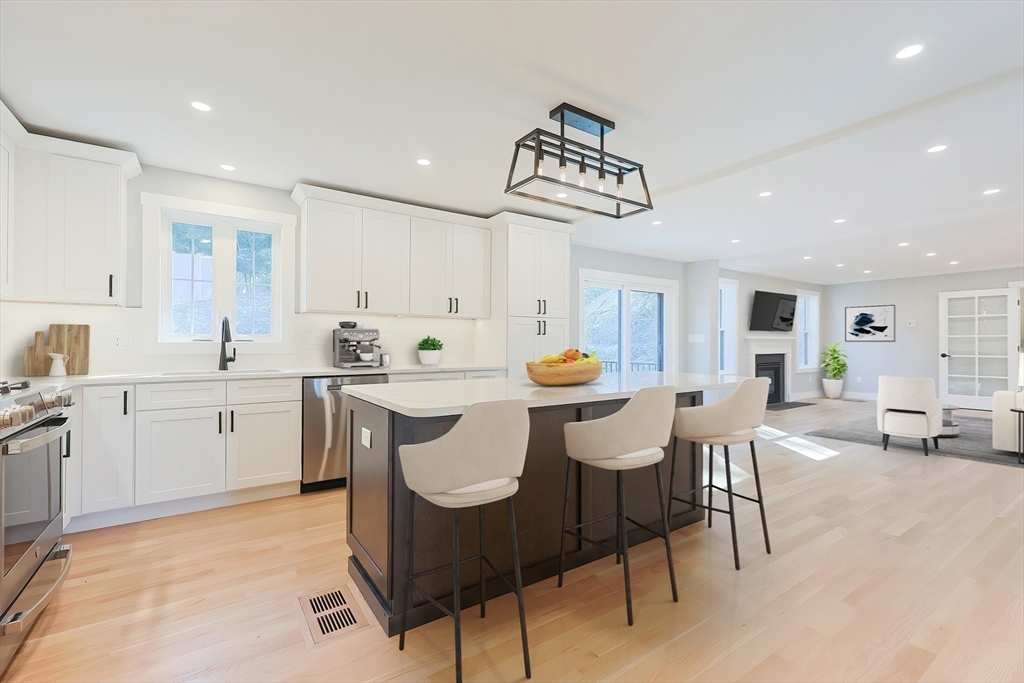 71 Old Nahant Road Wakefield, MA 01880 - Photo 12 of 42 a kitchen with a table chairs sink and cabinets