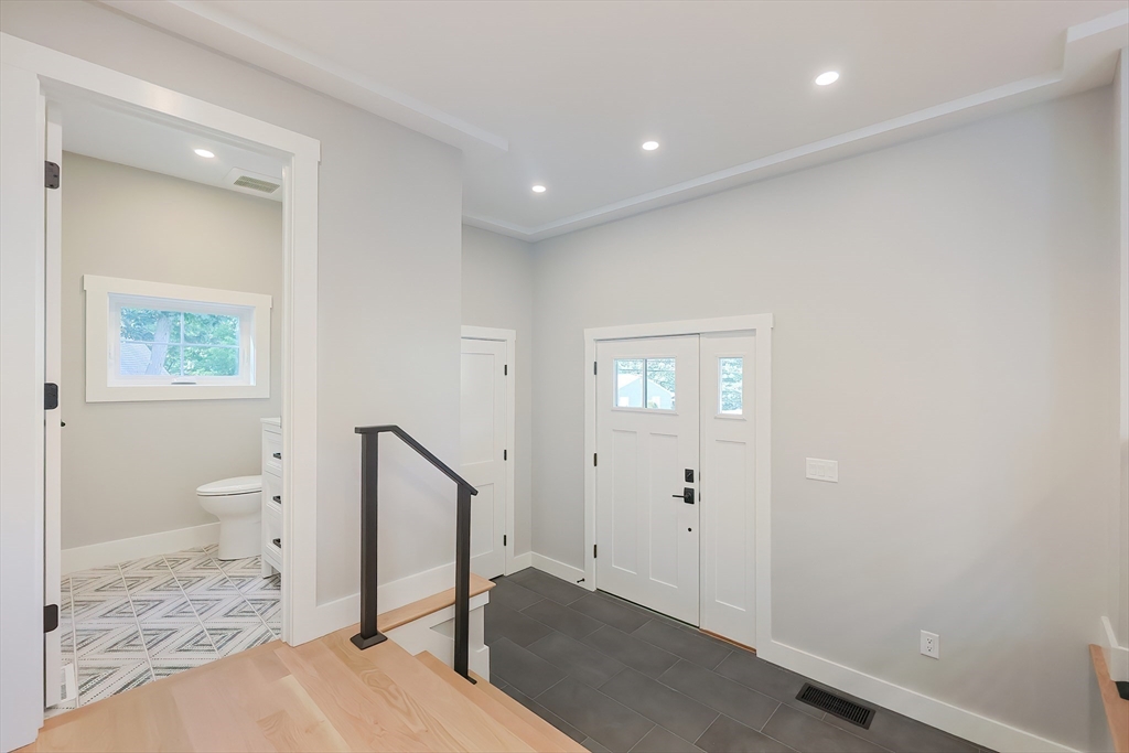 71 Old Nahant Road Wakefield, MA 01880 - Photo 14 of 42 a bathroom with a toilet a sink and mirror