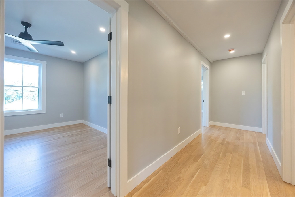 71 Old Nahant Road Wakefield, MA 01880 - Photo 19 of 42 a view of hallway with a large window and wooden floor