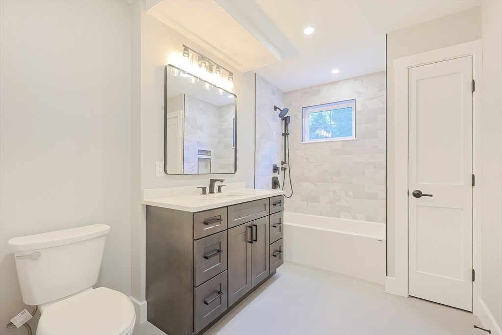 71 Old Nahant Road Wakefield, MA 01880 - Photo 24 of 42 a bathroom with a toilet sink and mirror