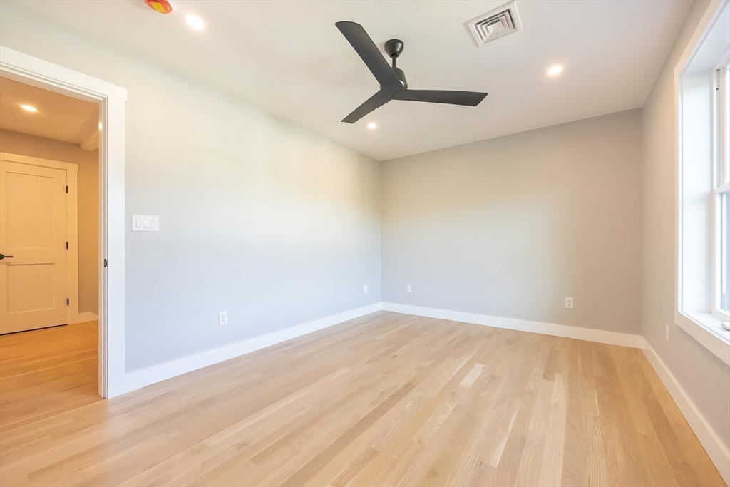 71 Old Nahant Road Wakefield, MA 01880 - Photo 25 of 42 an empty room with wooden floor and windows
