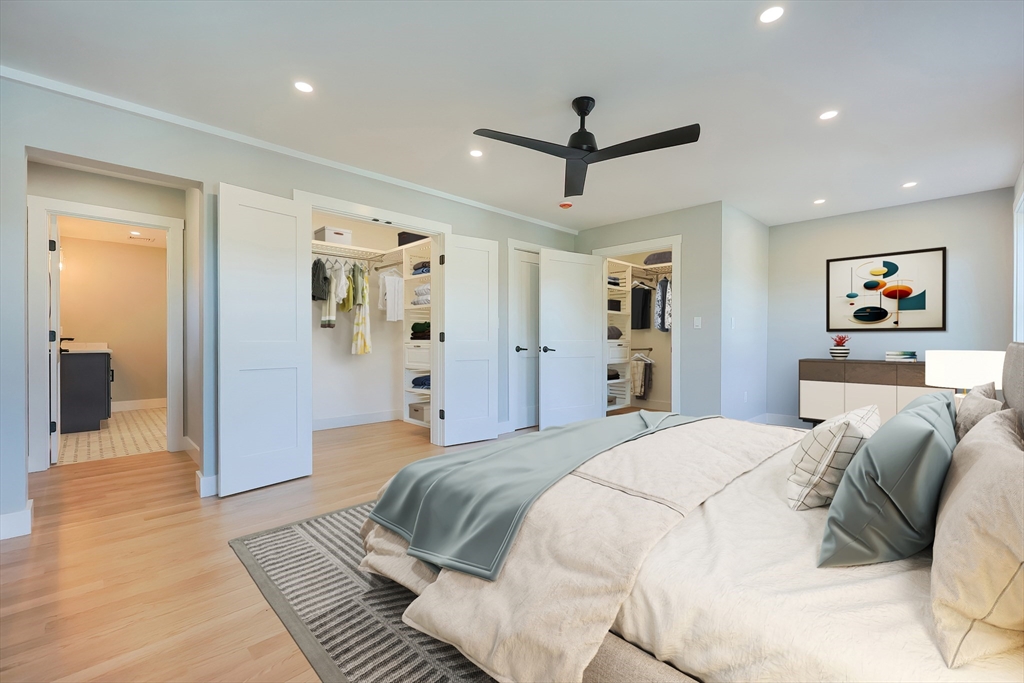 71 Old Nahant Road Wakefield, MA 01880 - Photo 28 of 42 a spacious bedroom with a large bed and a chandelier