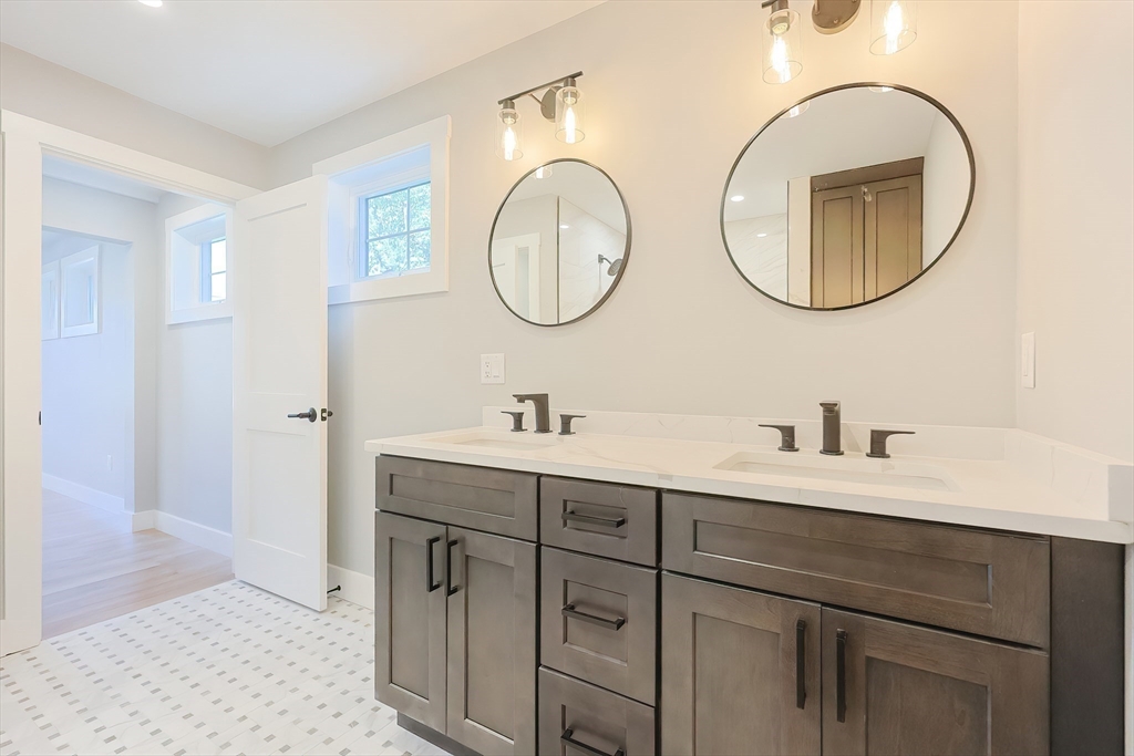 71 Old Nahant Road Wakefield, MA 01880 - Photo 29 of 42 a bathroom with a double vanity sink and a mirror