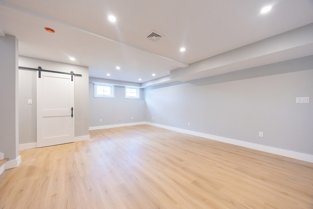 71 Old Nahant Road Wakefield, MA 01880 - Photo 36 of 42 an empty room with wooden floor and windows