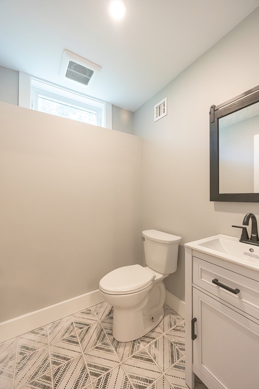 71 Old Nahant Road Wakefield, MA 01880 - Photo 37 of 42 a bathroom with a toilet a sink and a mirror