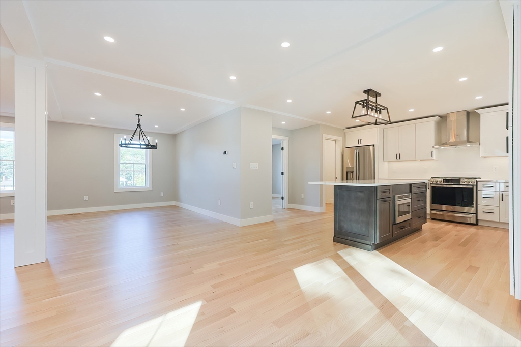71 Old Nahant Road Wakefield, MA 01880 - Photo 10 of 42 a large kitchen with stainless steel appliances kitchen island granite countertop a large counter top and a sink