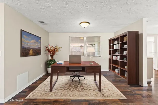 a living room with furniture and a rug