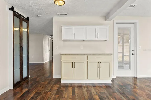 a view of kitchen with wooden floor