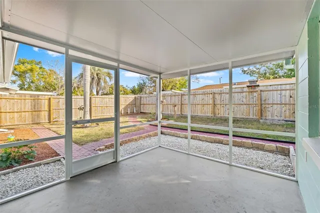 a view of an empty room with windows