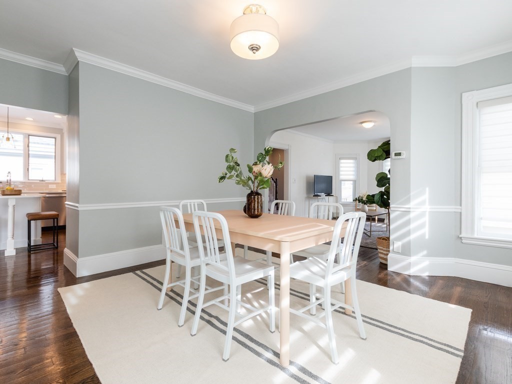 31 Gorham Street, Unit B Somerville, MA 02144 - Photo 11 of 36 a view of a dining room with furniture and wooden floor