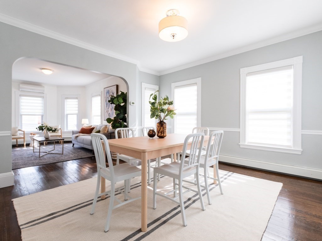 31 Gorham Street, Unit B Somerville, MA 02144 - Photo 12 of 36 a view of a dining room with furniture and wooden floor