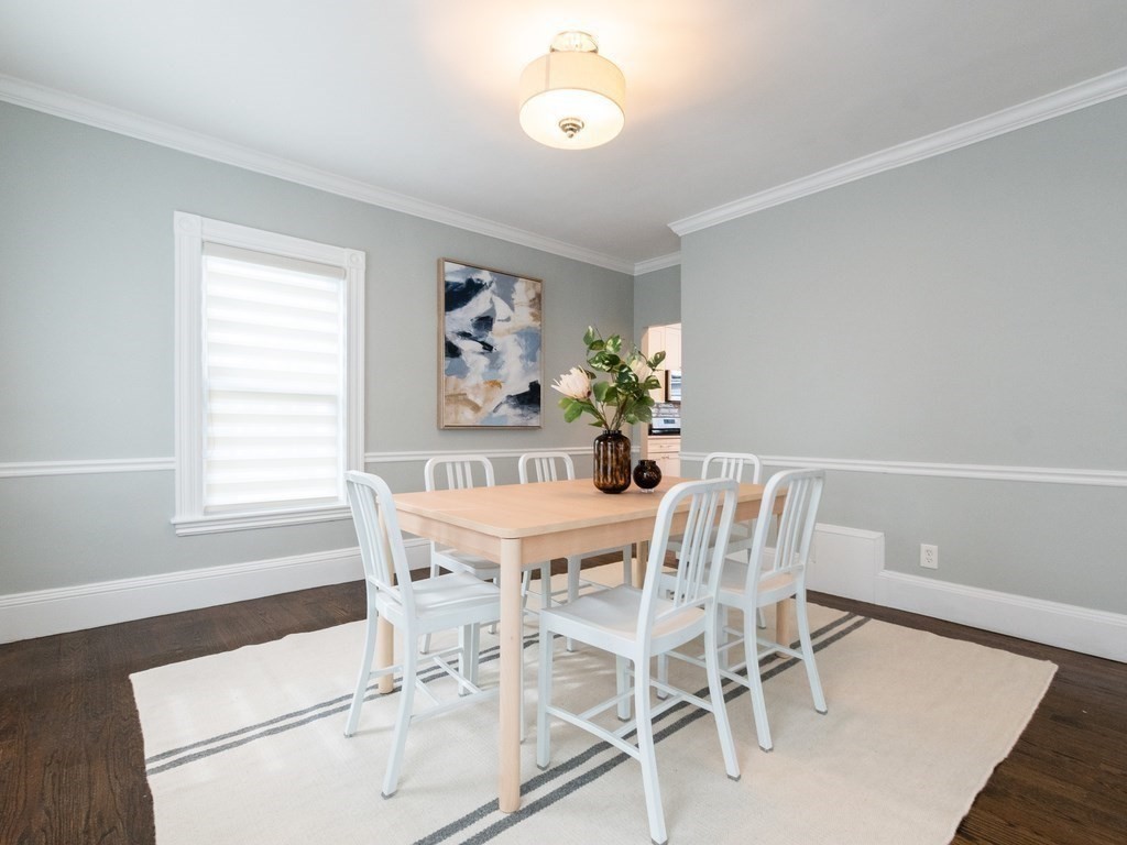 31 Gorham Street, Unit B Somerville, MA 02144 - Photo 13 of 36 a view of a dining room with furniture and a chandelier