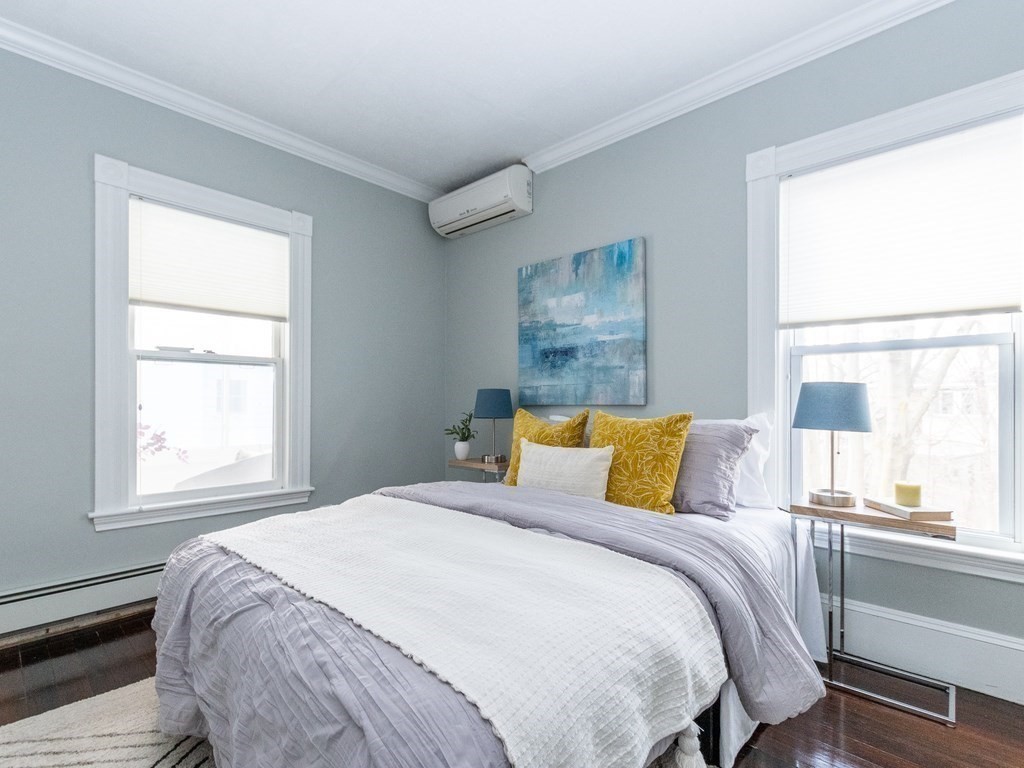 31 Gorham Street, Unit B Somerville, MA 02144 - Photo 15 of 36 a bedroom with a bed and a window