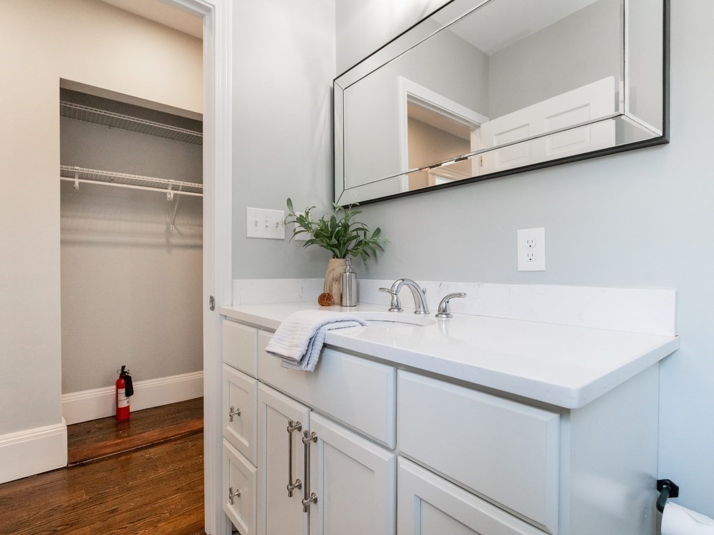 31 Gorham Street, Unit B Somerville, MA 02144 - Photo 17 of 36 a bathroom with a sink and a mirror