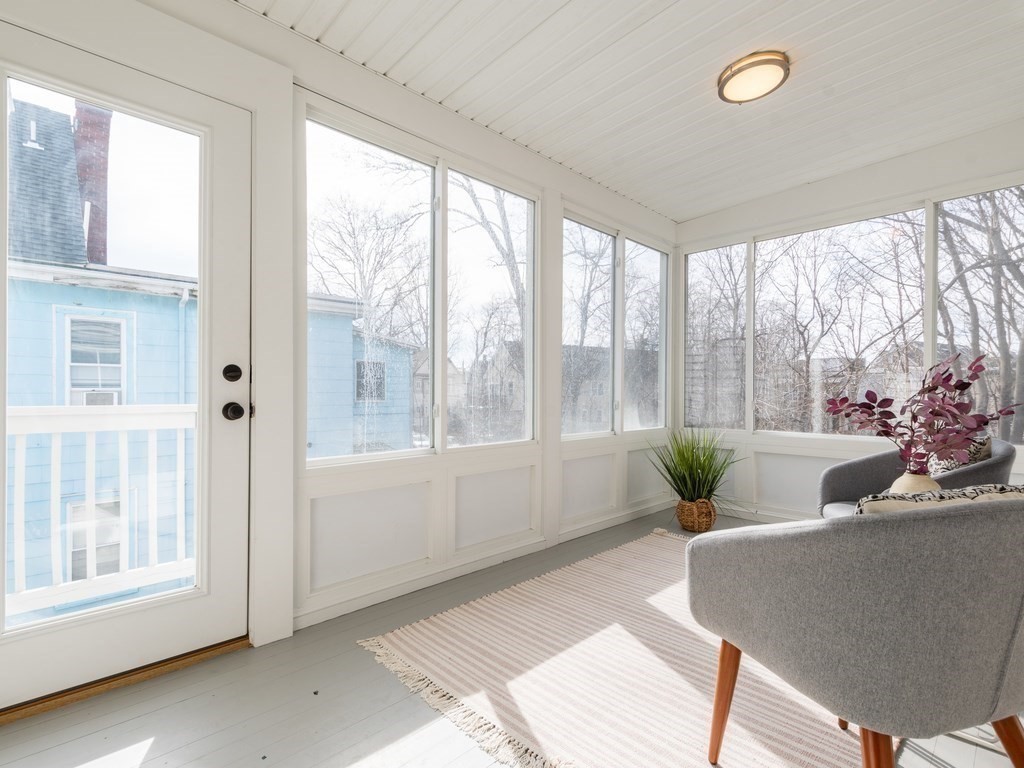 31 Gorham Street, Unit B Somerville, MA 02144 - Photo 20 of 36 a living room with furniture and a large window
