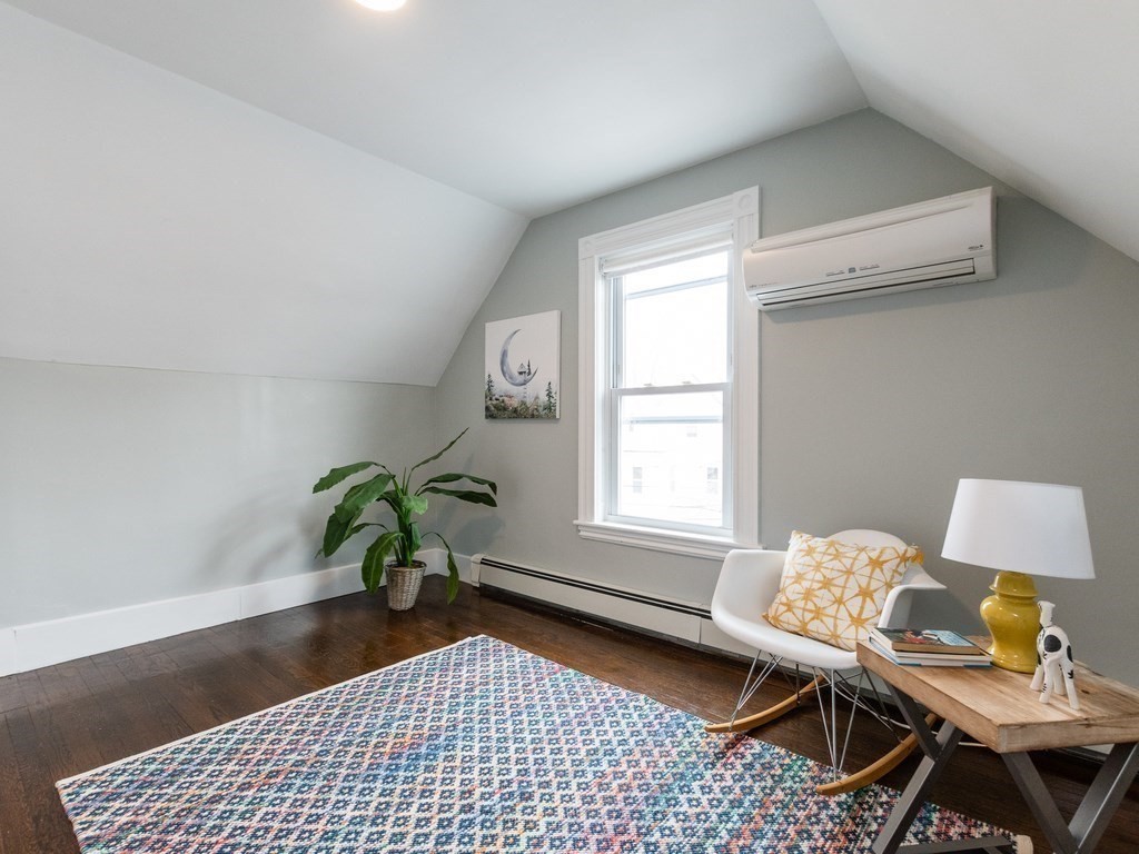 31 Gorham Street, Unit B Somerville, MA 02144 - Photo 25 of 36 a living room with furniture and a window