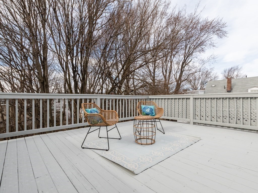 31 Gorham Street, Unit B Somerville, MA 02144 - Photo 28 of 36 a view of deck with chairs and wooden fence