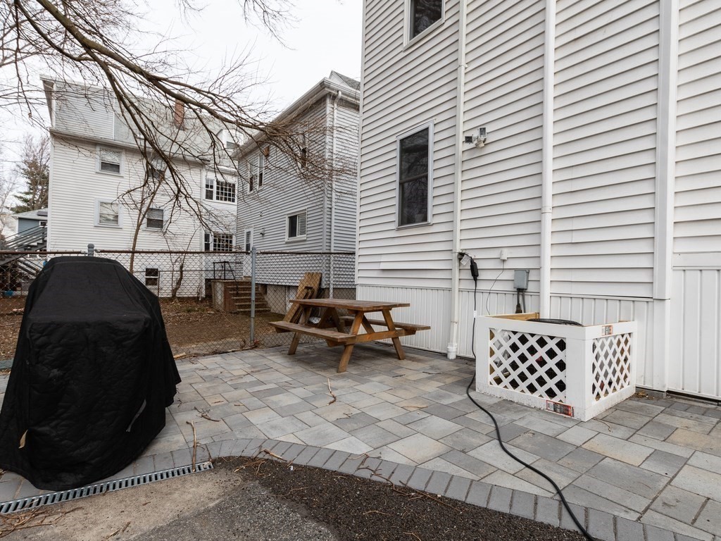 31 Gorham Street, Unit B Somerville, MA 02144 - Photo 30 of 36 a view of a patio with a table and chairs
