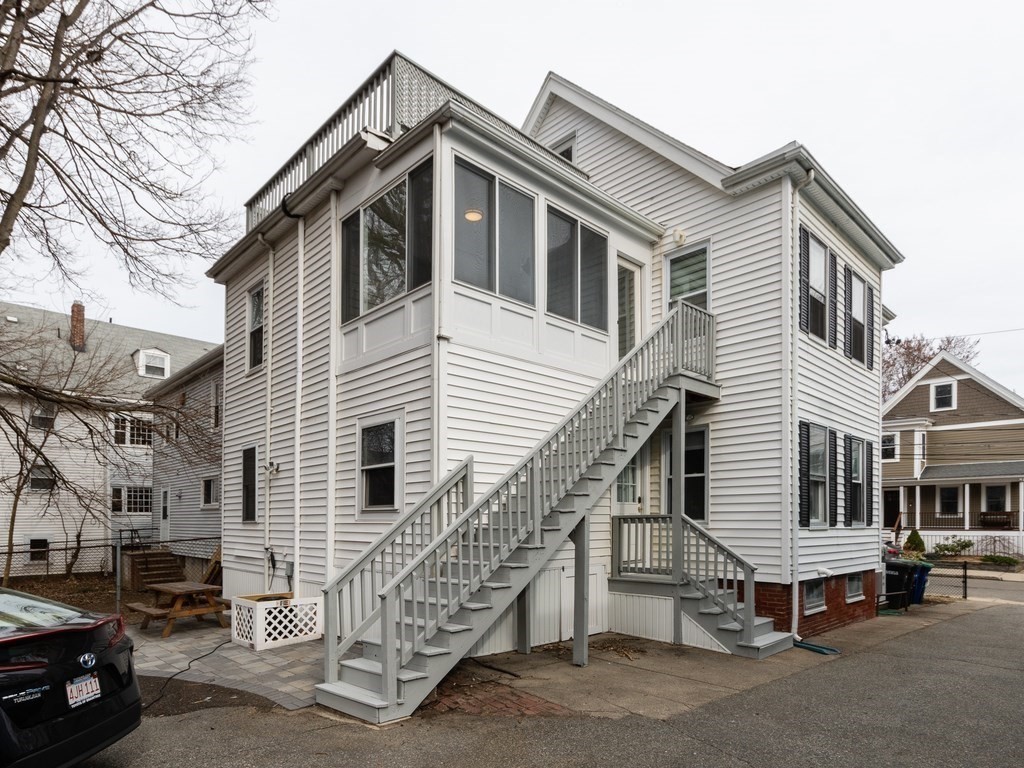 31 Gorham Street, Unit B Somerville, MA 02144 - Photo 31 of 36 a front view of a house with a garage